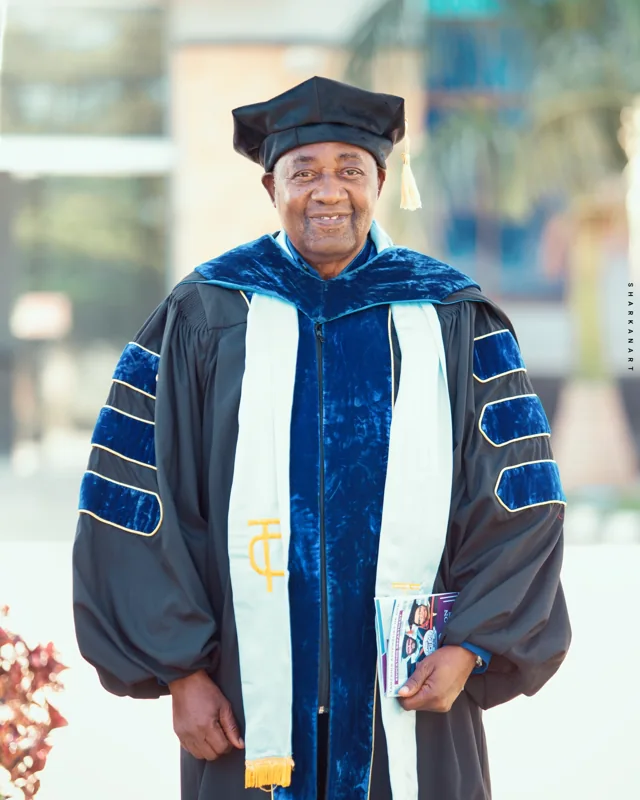 Dr. Jackson Nyanda pictured in academic regalia.